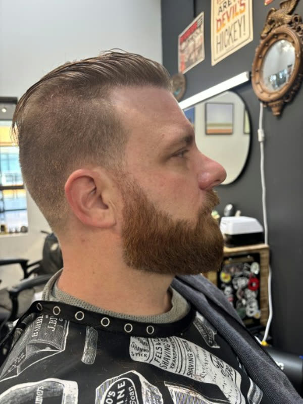 A men's haircut and beard trim at Strange Times, a Summerlin barbershop
